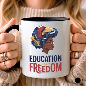 Mug with books forming hair and "Education is Freedom" text.