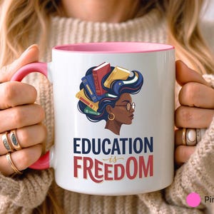 Mug with illustration of woman reading books, text "EDUCATION is FREEDOM".