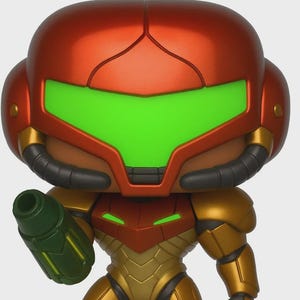 May include: A figurine of a character in gold and red armour, with a green visor and a green weapon. The figure stands on a black base. The armour has a metallic finish. A collectible item.