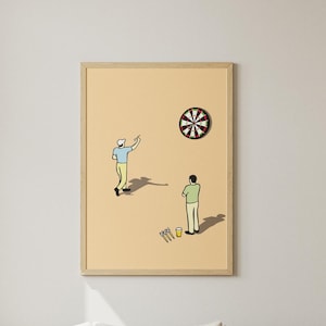 May include: A framed print shows two figures playing darts. The artwork is set against a pale yellow backdrop. The room features a light-coloured sofa, a round rug, and a wooden coffee table. A large window and decorative plants complete the interior.