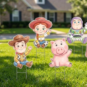May include: A set of five colorful yard signs featuring characters from the animated film Toy Story. The characters include Woody, Jessie, Buzz Lightyear, Hamm the Pig, and Slinky Dog, all waving. They are placed in a grassy yard.