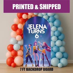 May include: A 7 ft backdrop board with the text "JELENA TURNS 6" and a graphic of three animated characters. The backdrop is framed by balloon arches in shades of red, peach, and blue. The text "PRINTED & SHIPPED" is at the top.