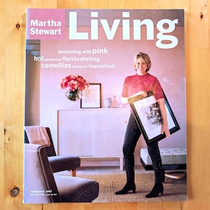 May include: A magazine cover featuring Martha Stewart with the title "Living" in large white letters. The cover includes text about decorating, food, and flowers. The magazine is dated February 1997.