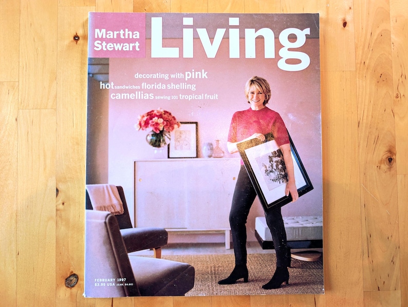 May include: A magazine cover featuring Martha Stewart with the title "Living" in large white letters. The cover includes text about decorating, food, and flowers. The magazine is dated February 1997.