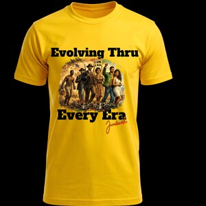 May include: Yellow t-shirt with the text "Evolving Thru Every Era" and a graphic of people from different time periods. The graphic includes the text "I AM A MAN" and a signature.