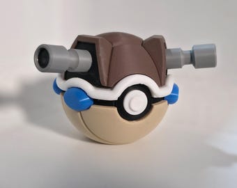 May include: A 3D-printed toy resembling a Pokémon character, featuring a tan, brown, white, black, and blue color scheme. It has two gray cylindrical extensions on either side and a circular design on the front.