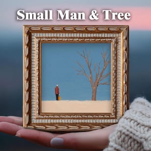 May include: A framed painting titled "Small Man & Tree" depicts a small figure in a red jacket and a bare tree against a blue sky. The painting is in a gold ornate frame, held in a person's hand.