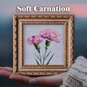 May include: A square oil painting titled Soft Carnation featuring two pink carnations with green stems and leaves, rendered with thick impasto brushstrokes on a light background, encased in an ornate, textured gold-toned frame.
