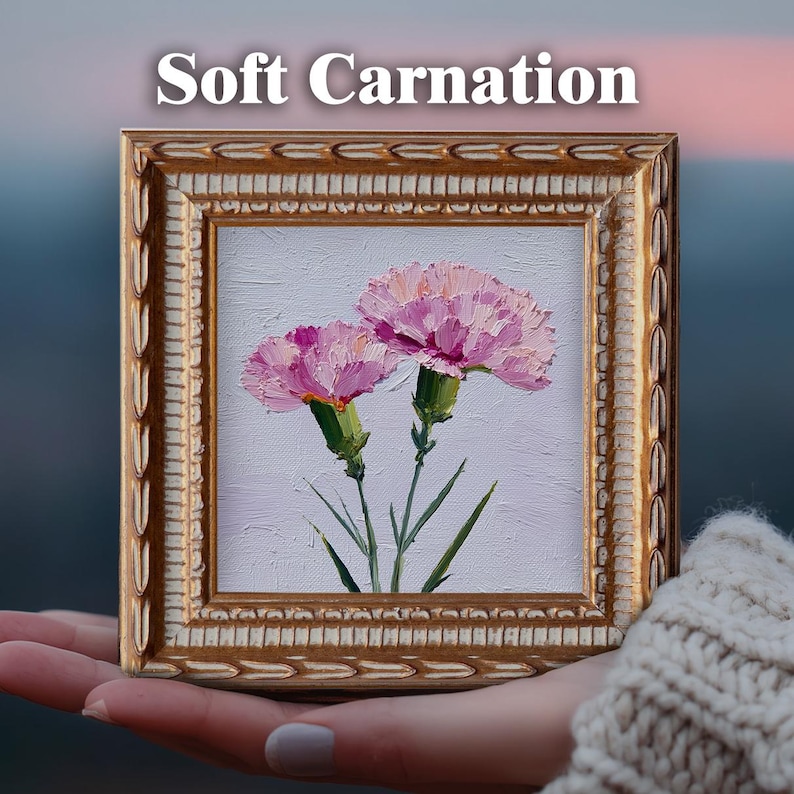 May include: A square oil painting titled Soft Carnation featuring two pink carnations with green stems and leaves, rendered with thick impasto brushstrokes on a light background, encased in an ornate, textured gold-toned frame.