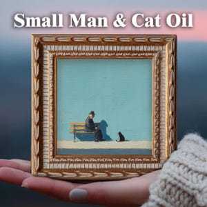May include: A framed oil painting titled "Small Man & Cat Oil" depicts a man seated on a bench with a black cat. The artwork features a light blue background and a gold-colored ornate frame. The painting is held in a person's hand.