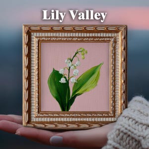 May include: A square painting titled Lily Valley featuring a delicate lily of the valley plant with white bell-shaped flowers and green leaves on a soft pink background, encased in an ornate, textured gold frame with a decorative border.