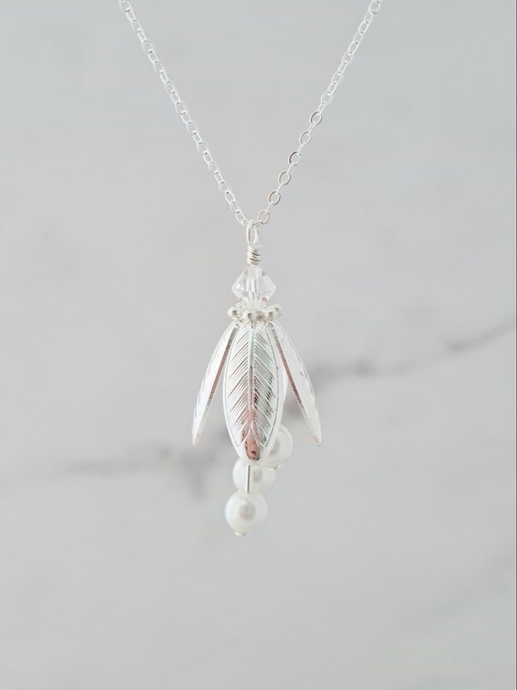 Jingle bell deals flower necklace hallmark