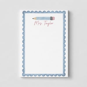 May include: A rectangular notepad with a white center and a scalloped light blue border. At the top, there is a horizontal illustration of a light blue pencil with a pink eraser. The text Mrs. Taylor is printed in a pink script font below it.