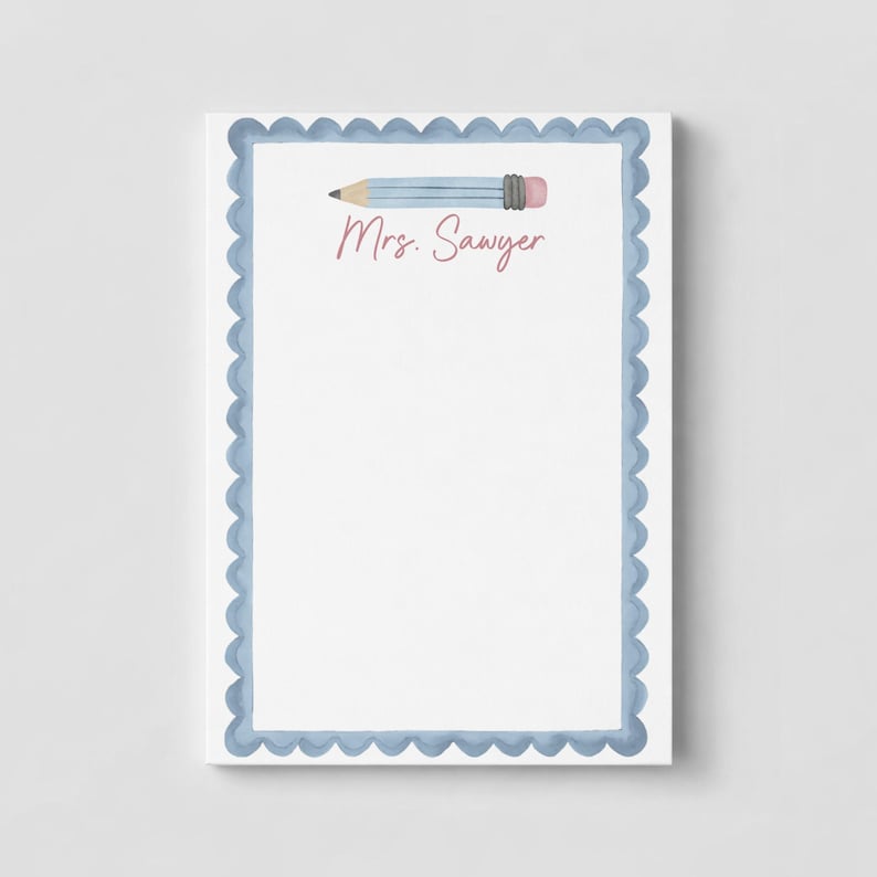 May include: A rectangular notepad with a white center and a scalloped blue border. At the top, there is a horizontal illustration of a light blue pencil with a pink eraser. The text Mrs. Sawyer is printed in a pink script font below the pencil.