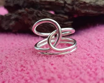 Zilveren ring met grote knoop: verstelbare duimring