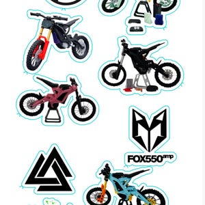 May include: A collection of stickers featuring electric dirt bikes in various colors, including black, pink, and blue. Some stickers include logos and text such as "FOX550amp" and "SUR RON".