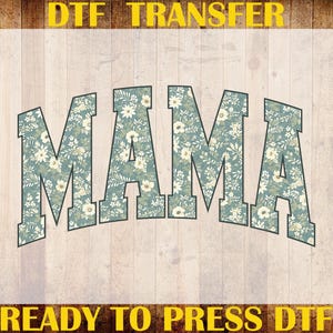 May include: A ready-to-press DTF transfer featuring the word "MAMA" in a floral pattern. The letters are in a teal color with white and cream-colored flowers. The image is surrounded by text that reads "DTF TRANSFER" and "CUSTOM PRINT HEAT TRANSFER".