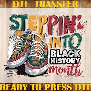 May include: DTF transfer design featuring a pair of sneakers with the text "Steppin' Into Black History Month." The sneakers are primarily green, orange, and red, with white laces and soles. The design is set against a light wood grain background.