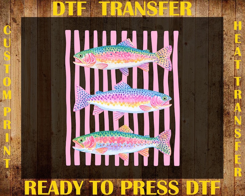 May include: DTF transfer design featuring three colorful rainbow trout on a pink striped background. The image includes the text "DTF TRANSFER", "CUSTOM PRINT", "HEAT TRANSFER", and "READY TO PRESS DTF" in yellow.