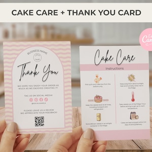May include: Two pink cards with text: "Cake Care + Thank You Card." The "Thank You" card has a pink wavy border and says "Thank You." The "Cake Care" card has instructions for cake care. The cards are held by hands.