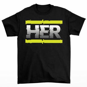 May include: Black t-shirt with the word "HER" in a glitch-style font. The word is white with a gray gradient and is framed by two horizontal neon yellow bars. A simple, modern design.