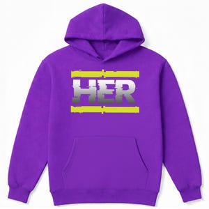 May include: A purple hoodie with a front pocket and a hood. The word "HER" is printed on the front in a gradient gray color, with yellow horizontal lines above and below the text.