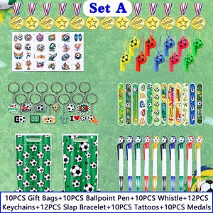 May include: A collection of soccer-themed party favors, including gold medals, whistles, keychains, slap bracelets, tattoos, gift bags, and pens. The items are arranged on a green surface, with the text "Set A" at the top.