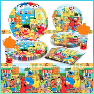May include: A colourful Sesame Street party supplies set featuring plates, cups, napkins, and a decorative banner. The designs include images of Elmo, Ernie, Bert, Cookie Monster, and other characters in a city scene. The word "LIVE!" is displayed on the plates.