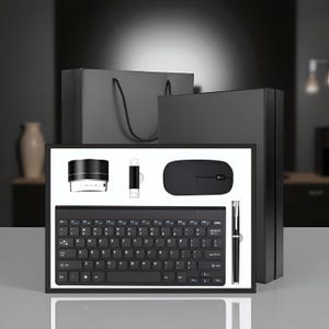 May include: A black computer accessory set, comprising a keyboard, mouse, USB drive, pen, and speaker. The set is presented in a black box with a matching gift bag, suitable for office or home use.
