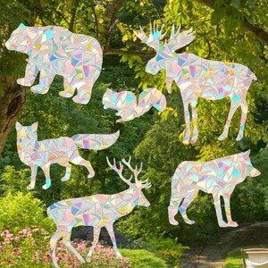 May include: A set of six iridescent vinyl stickers featuring various animals, including a bear, fox, moose, squirrel, deer, and wolf. The stickers are perfect for adding a touch of whimsy to laptops, water bottles, journals, and more.