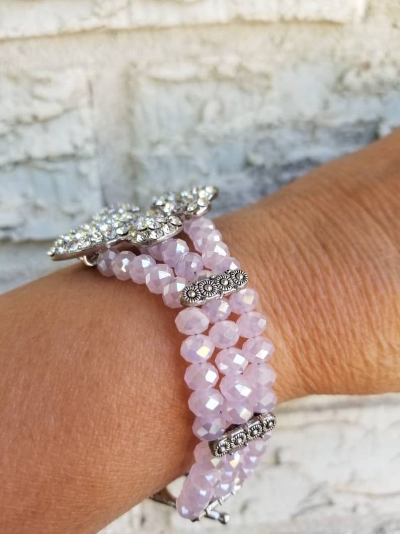 Pink Fleur de lis pink crystal bracelet 8in.