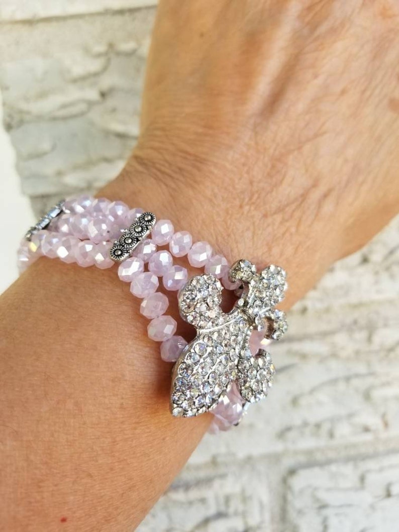 Pink Fleur de lis pink crystal bracelet 8in.