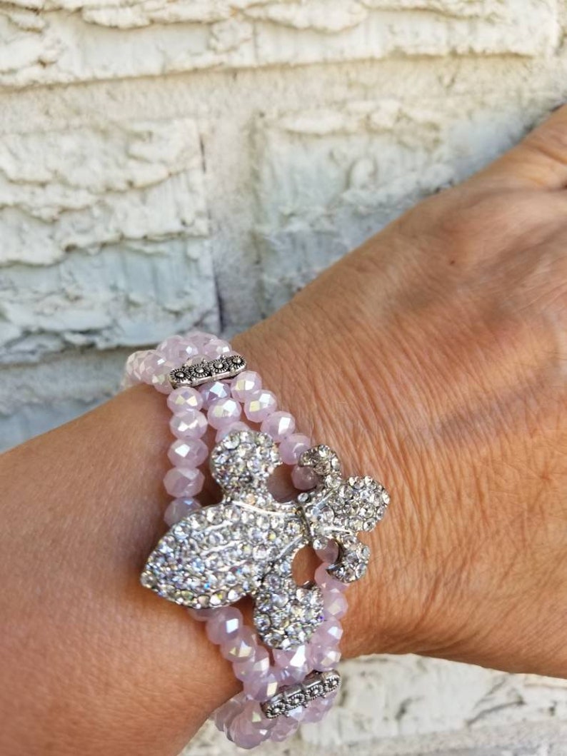 Pink Fleur de lis pink crystal bracelet 8in.