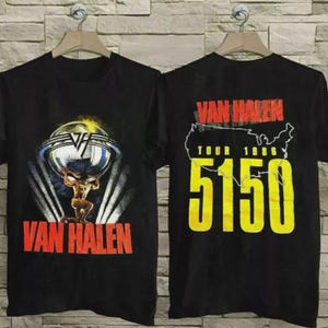 May include: Black t-shirts featuring a Van Halen design. One shirt displays a muscular figure holding a globe with the band's logo and name. The other shirt shows the band's name, tour details, and the number 5150.