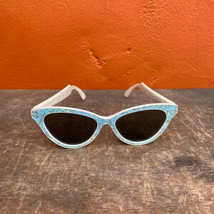 Vintage 1950s Cat Eye Sunglasses. Baby blue & Gold atomic print. Pinup Rockabilly