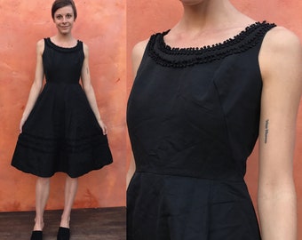 Vintage 1950s Black Party Swing Fit Flare Cocktail Dress pinup rockabilly. Fit Flare dress. gorgeous ball trim. 26 waist