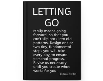 May include: A black hardcover journal featuring white text that reads: LETTING GO really means going forward, so that you can't slip back into old patterns. Design one or two tiny, fundamental steps you will take every day. Signed by Bridgette Hayden.
