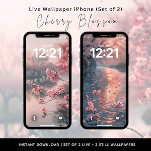 May include: Two black iPhones displaying cherry blossom live wallpapers. The screens show a pink and white floral design with the time 12:21 displayed. The text "Live Wallpaper iPhone (Set of 2)" and "Cherry Blossom" are at the top.