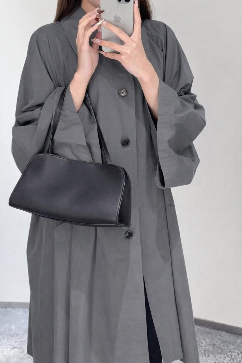 black leather shoulder bag
black leather clutch
peggy style bag
minimalist leather handbag
sculptural leather purse
architectural handbag
structured leather bag
top handle leather purse
luxury leather clutch
designer inspired handbag
modern leather shoulder bag
evening leather bag
small black leather purse
crossbody leather clutch
minimalist shoulder purse