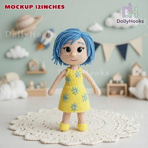 May include: A handmade crochet doll, approximately 12 inches tall, with blue hair and a yellow dress adorned with blue flower accents. The doll has a smiling expression and is standing on a white, lacy doily. The background includes decorative elements.