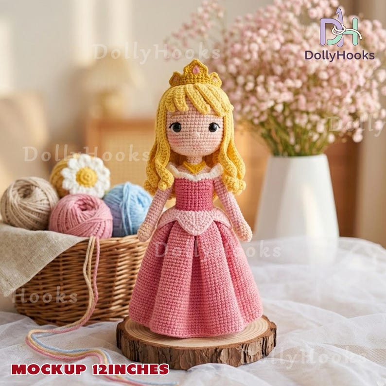 May include: A handmade crochet doll of a princess, approximately 12 inches tall, wearing a pink dress and a golden crown. The doll has blonde hair and is displayed on a wooden slice. The background includes yarn and flowers.