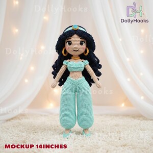 May include: A handmade crochet doll of a princess, approximately 14 inches tall. The doll has black hair, gold hoop earrings, and is wearing a turquoise outfit. The doll is standing on a white surface with a soft, textured appearance. The text "MOCKUP 14INCHES" is at the bottom.