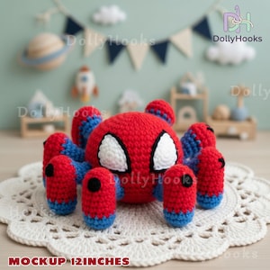 May include: A handmade crochet Spider-Man toy, primarily red with blue and white accents. The toy has eight legs and large white eyes. The text "MOCKUP 12 INCHES" is at the bottom of the image.