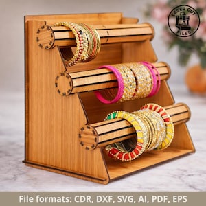 May include: A wooden bangle display stand with three levels, each holding colorful bangles. The bangles are adorned with various beads and designs. The stand is made of light brown wood and features the text "LASER CUT FILES".