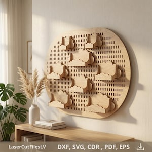 May include: A circular light-colored wooden pegboard wall organizer featuring multiple cloud-shaped shelves attached to the perforated surface. The text LaserCutFilesLV DXF, SVG, CDR, PDF, EPS is printed at the bottom of the image.