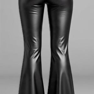 May include: Black faux leather flared pants. The pants have a high waist and a sleek, shiny appearance. The flared legs create a dramatic silhouette, perfect for a night out or a bold fashion statement.