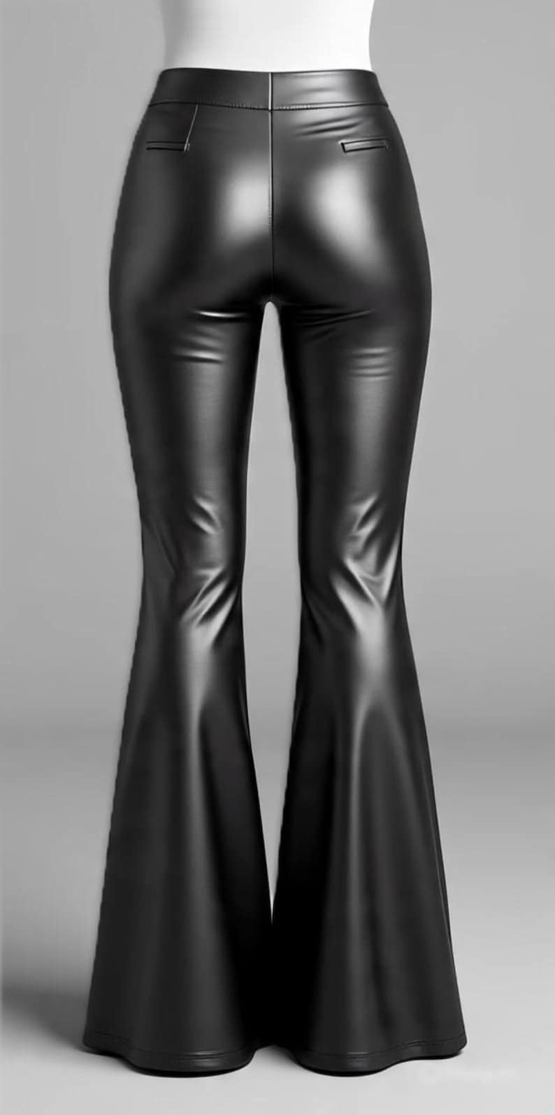 May include: Black faux leather flared pants. The pants have a high waist and a sleek, shiny appearance. The flared legs create a dramatic silhouette, perfect for a night out or a bold fashion statement.