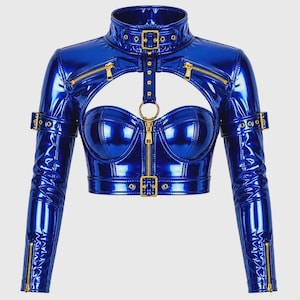 May include: A long-sleeve cropped top in a glossy metallic blue finish. It features a high collar with a buckle strap, gold-tone zippers on the chest and cuffs, a central gold ring connector, and adjustable buckle straps on the upper arms and waist.