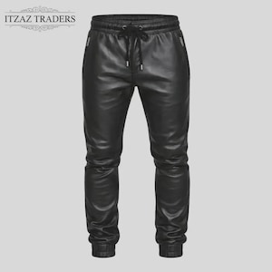 May include: Black leather joggers with a drawstring waist and elasticated cuffs. The trousers have two zipped pockets and a relaxed fit. The brand name "ITZAZ TRADERS" is at the top left.