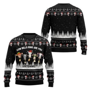 May include: A black long-sleeve sweater featuring a holiday-themed pattern with white pine trees, snowflakes, and cows wearing Santa hats and bells. The front displays the text "COW BELLS RING ARE YOU LISTENING?" above four cows with bells.